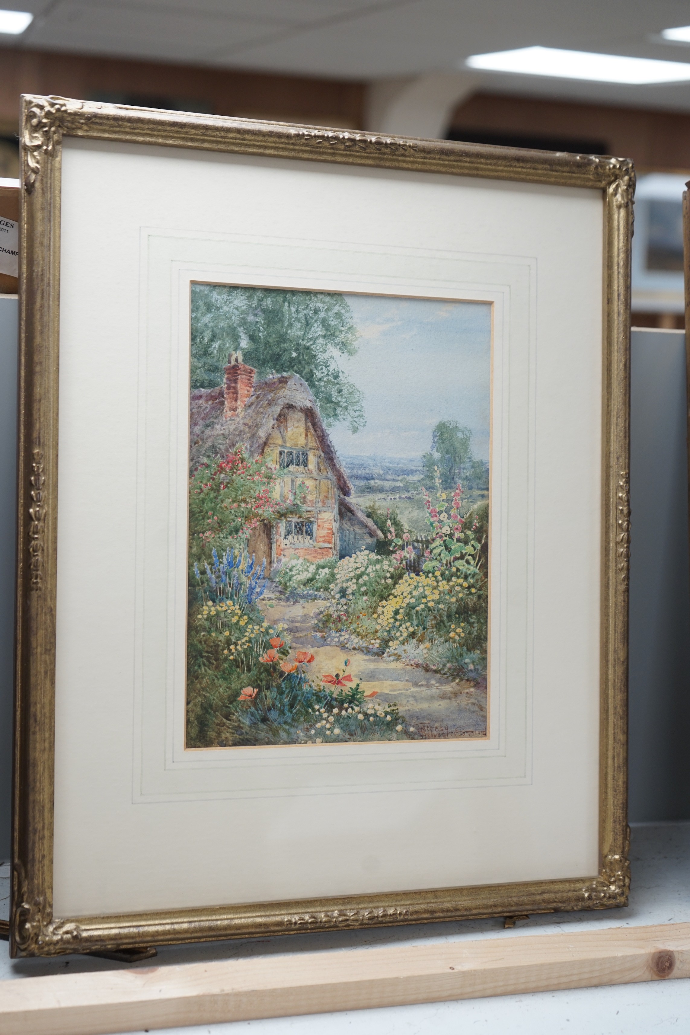 Teresa Sylvester Stannard (1898-1947), watercolour, A cottage garden, signed, 25 x 18cm